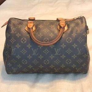 Luis Vuitton large “Speedy” bag